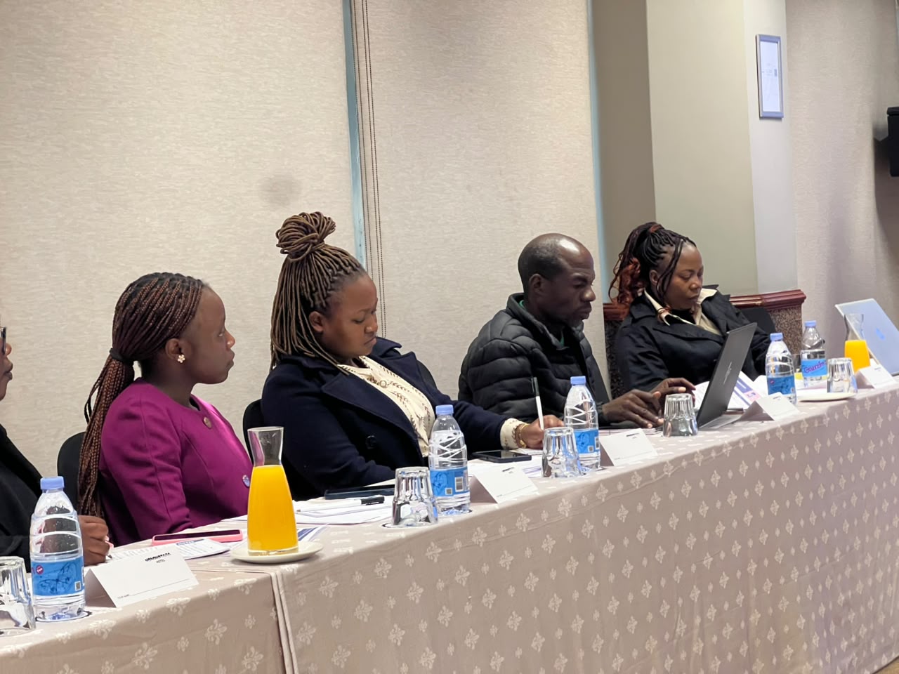 Delegates seated at the training table taking notes during an NPBA workshop session