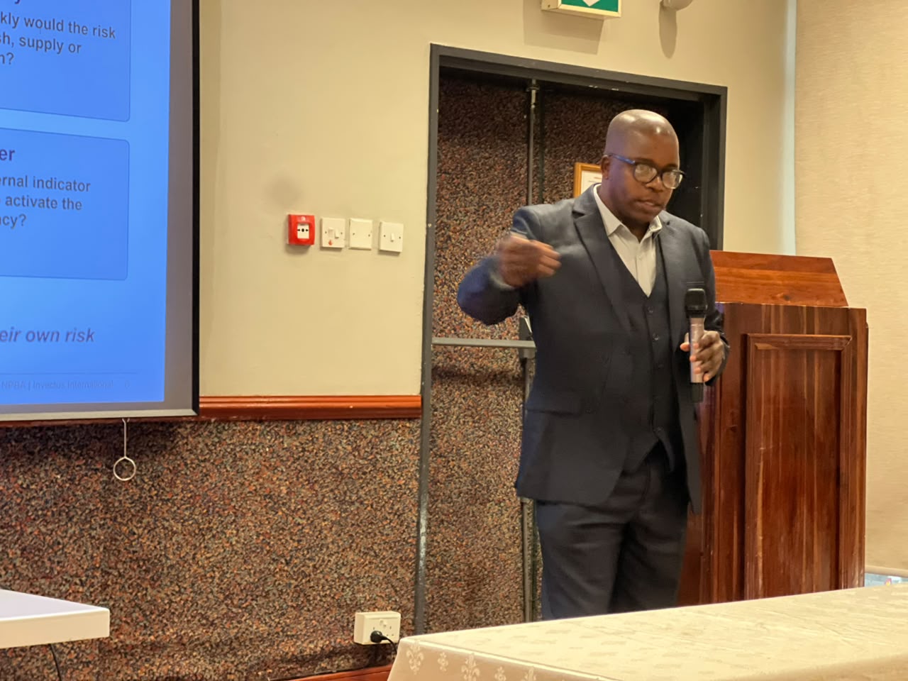 An NPBA facilitator presenting risk management slides to workshop delegates