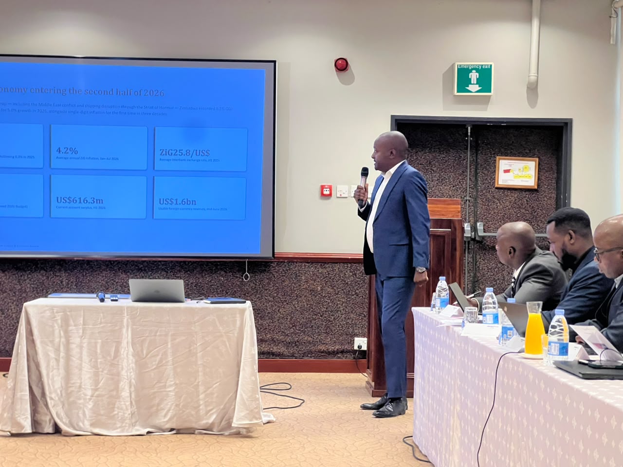 A facilitator presenting the 2026 Zimbabwe economic outlook to delegates at an NPBA workshop
