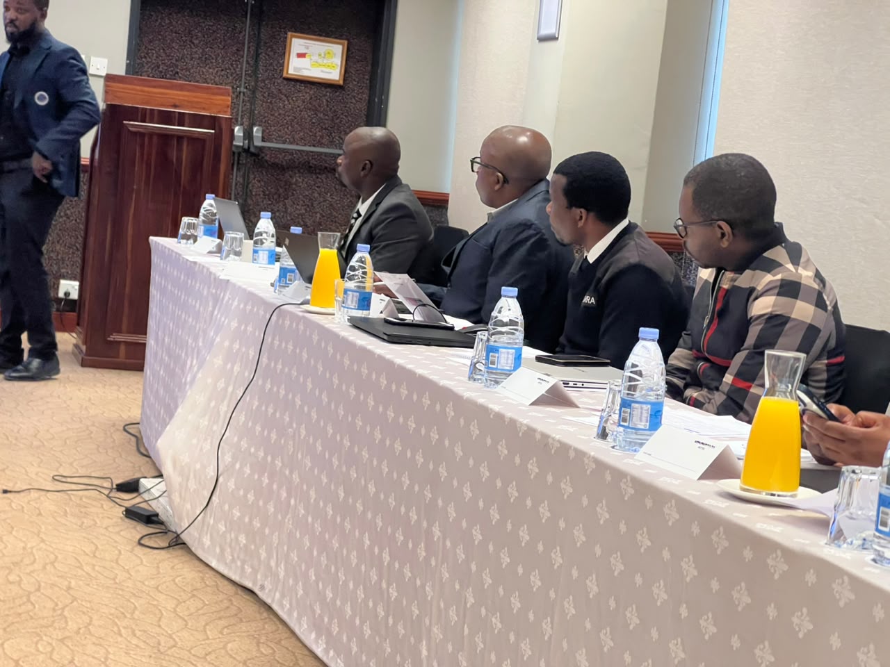 A panel of NPBA workshop delegates following the session with laptops and printed materials